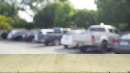soft focus wooden table with blur cars parkingの写真素材