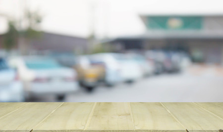 soft focus wooden table with blur cars parkingの写真素材