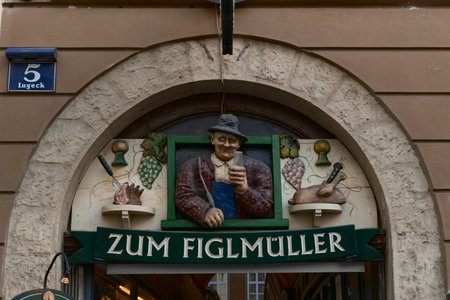 Detailed close-up of the ornate relief on a Vienna passage arch, showing central male figure and decorative food motifs on the sides.の写真素材