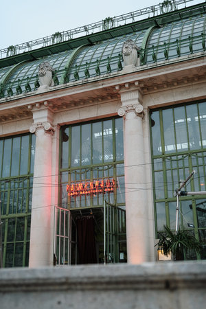 Facade of the famous Palmhause café in Vienna featuring antique columns and large windows with...