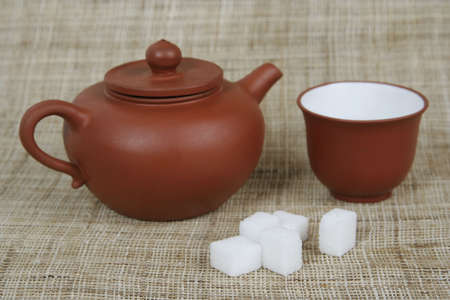 Chinese teapot with cup and white sugarの写真素材