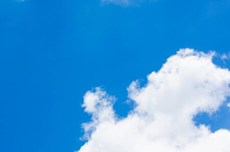 Blue sky and white cloud background on sunny day with copy space for text or wordings decoration