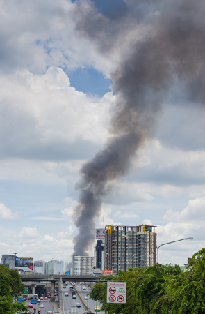 BANGKOK, Thailand - July 28, 2016: Fire smoke burning at Major Cineplex theatre (Pinklao branch) flowing to the sky during the day time in Bangkok on week dayのeditorial素材