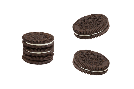 Cookies and cream chocolate cookies in stack and single pieces isolated on white background (clipping path included)の写真素材