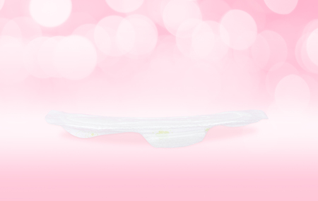 White, new, clean, thin, and slim sanitary napkin pad lay flat isolated on light pink background for menstrual period day use on every month  (clipping path included), health and body care conceptの写真素材