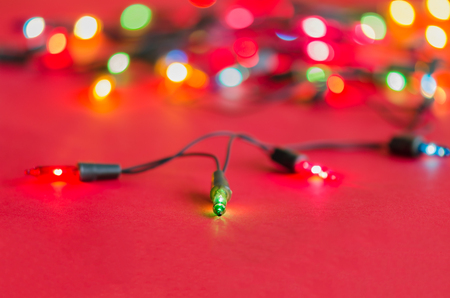 Xmas lights bulbs on string (selective focus) in multi coloursの写真素材