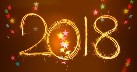 2018 Sparkle Light painted in numbers for happy new year at night time over dark brown background with colourful stars bokeh to celebrate special holiday occasion, Xmas fun party, or important eventの写真素材