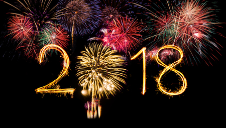 2018 Fireworks over dark sky black background with copy space for happy new year celebrationの写真素材
