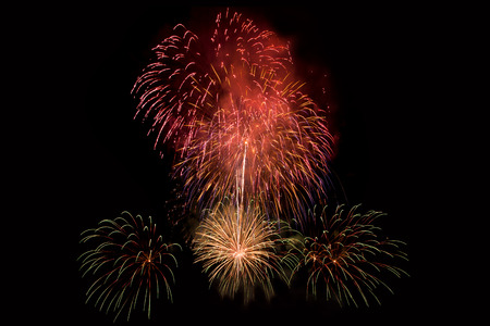 Colourful Fireworks at night over dark sky to celebrate New Year eve and special occasion on holidaysの写真素材