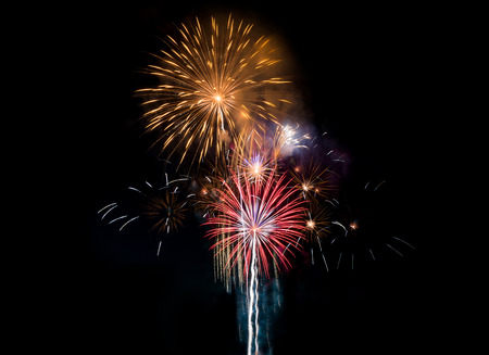 Colourful Fireworks at night over dark sky to celebrate New Year eve and special occasion on holidaysの写真素材