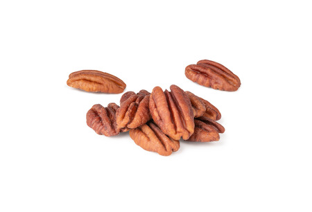 Pecan nuts topped with light salt isolated in pieces on white background (clipping path included of...