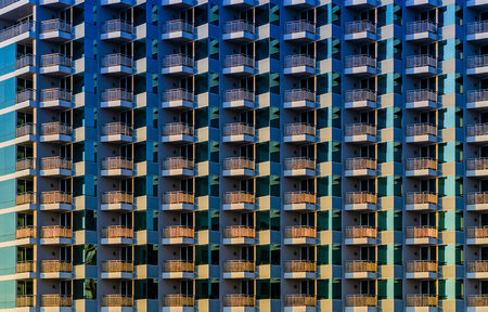 Pattern of window balcony room of building or tower with shadow and light in rainbow colours, abstract pattern backgroundの写真素材