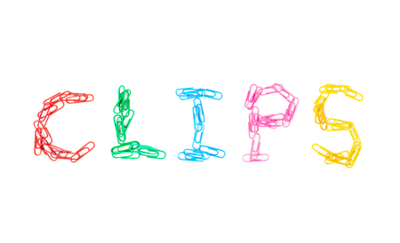 Paper Clips of many colours arranged in letters as clips on white background, Back to School conceptの写真素材
