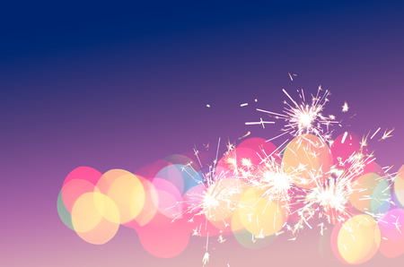 Sparkler light colourful bokeh fun background for special party, sweet love, holiday, festival, new year celebration with copy space for text, logo, or wording decoration or insertionの写真素材