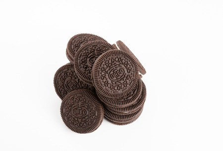 BANGKOK, Thailand - November 6, 2018: OREO cookies of two chocolate wafers with a sweet creme filling in between arranged in stack on white background (American famous cookie brand)の写真素材
