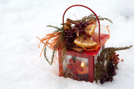 Lantern with candlelight in the snowの写真素材