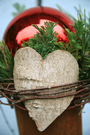 Christmas decoration with a wooden heartの写真素材