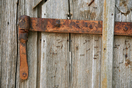 Rusty hinge of an old barn doorの写真素材