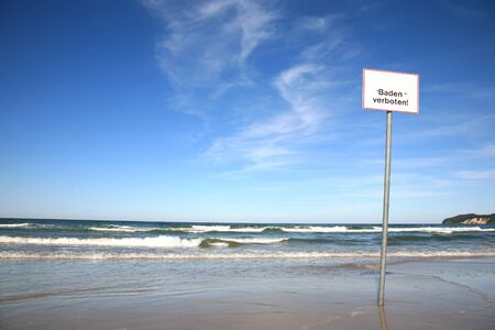 Sign on the beach reading \\\Baden verboten\\\ which translates into \\\No swimming\\\ in English...