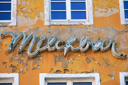 Old abandoned peeling house facade in Germany