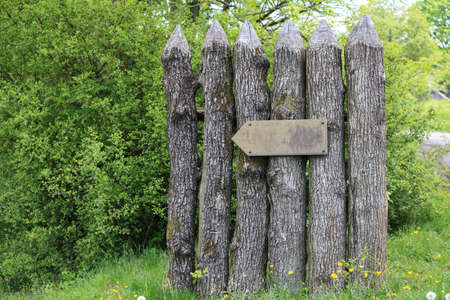 Wooden poles with blank directional signの写真素材