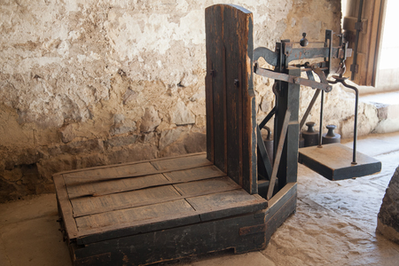 Old wooden platform scales in antique mill houseの写真素材