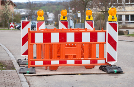Barrier with warning lights at construction siteの写真素材