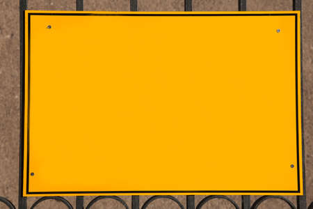 Blank rectangle yellow sign with black frame and copy spaceの写真素材