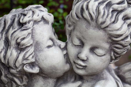 Figurine of a boy and a girl kissingの写真素材