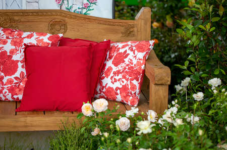 Outdoor wooden bench with comfortable pillowsの写真素材