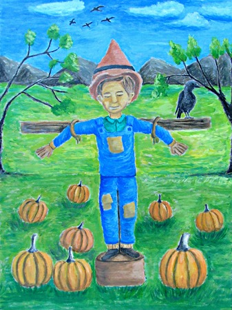 Scarecrow boy with pumpkinsの写真素材