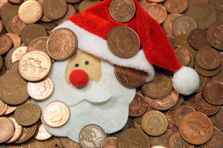 A flurry Santa face amongst coins                の写真素材