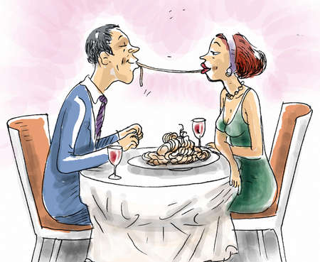 A couple in the restaurant sharing spaghettiの写真素材