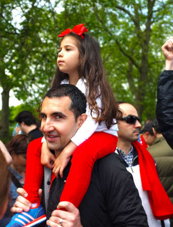 Young girl with his father during a demoのeditorial素材