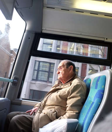 Elderly man on the busのeditorial素材