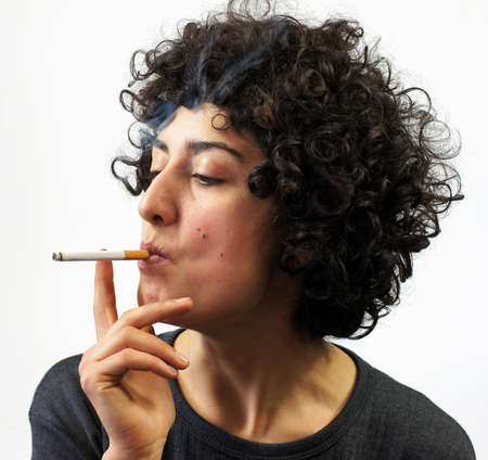 Young woman smokesの写真素材