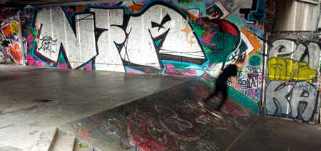 Skateboarder enjoy his time in the skateboard area of Royal Festival Hall, Londonのeditorial素材