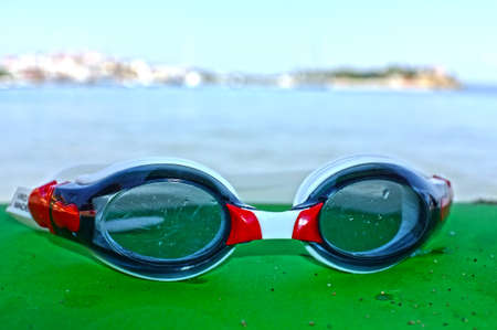 Blue goggles by the seaの写真素材