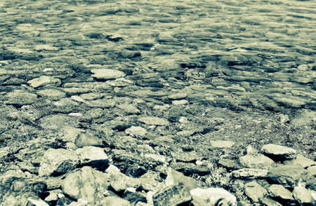 Shallow water with stones insideの写真素材