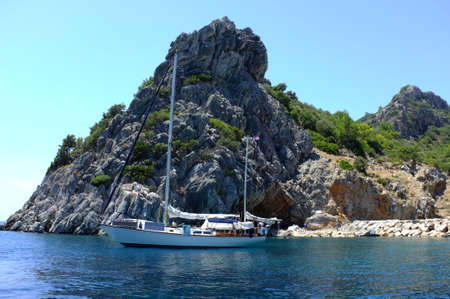 Sailing boat around rocky hillsの写真素材