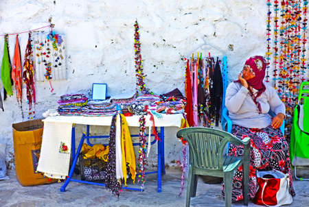 Village woman selling hand-knitted giftsのeditorial素材