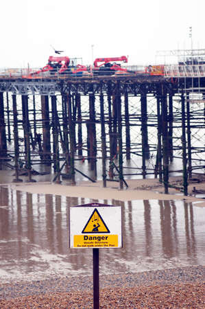 Wooden old pier being renovated on the beachの写真素材