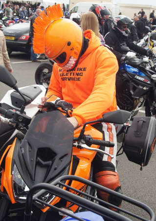 Biker in orange costumeのeditorial素材