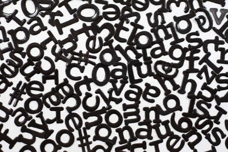Cutout letters mixed in abstract designの写真素材