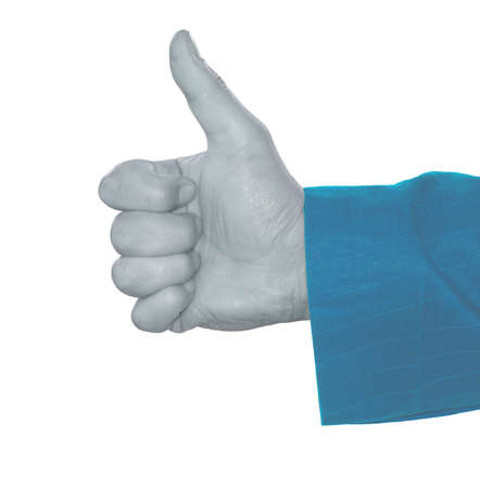 Human hand makes thumbs up in blue effectの写真素材