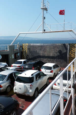 Cars on rows waiting to be unloaded the ferryboatのeditorial素材