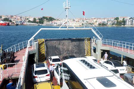 Vehicles wait to unload on ferryのeditorial素材