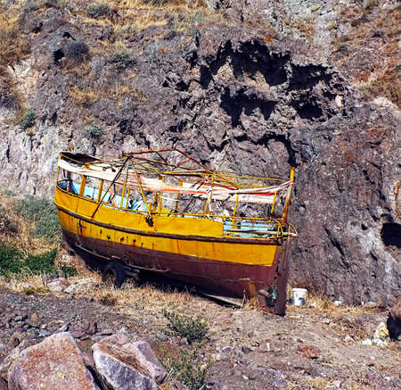 Small fishing boat on dry landの写真素材