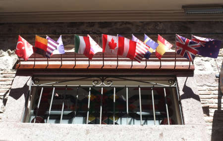 Little country flags on a hotel windowの写真素材