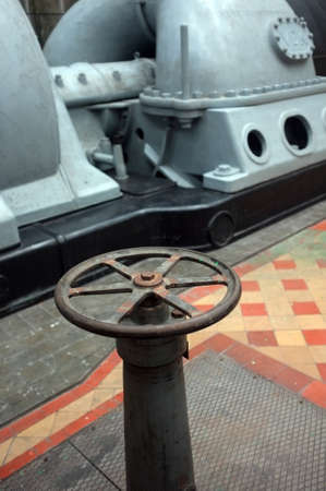 Old rusty valve in an old electricity power plantの写真素材